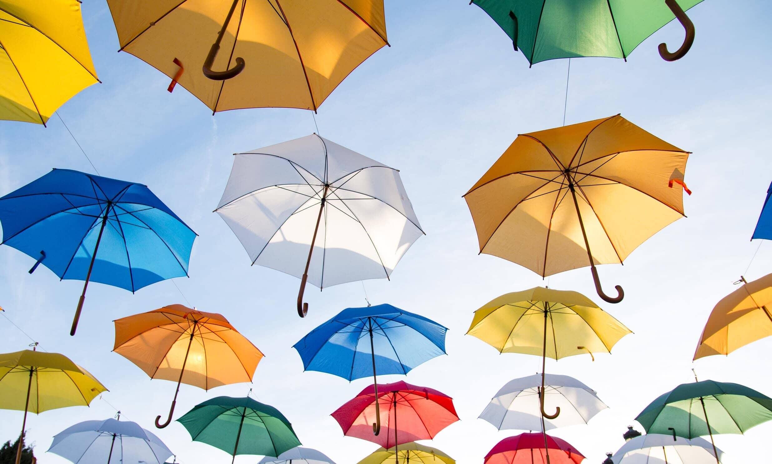 Colourful umbrellas against the sky